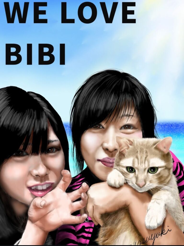 2人のご家族様に抱っこされている猫